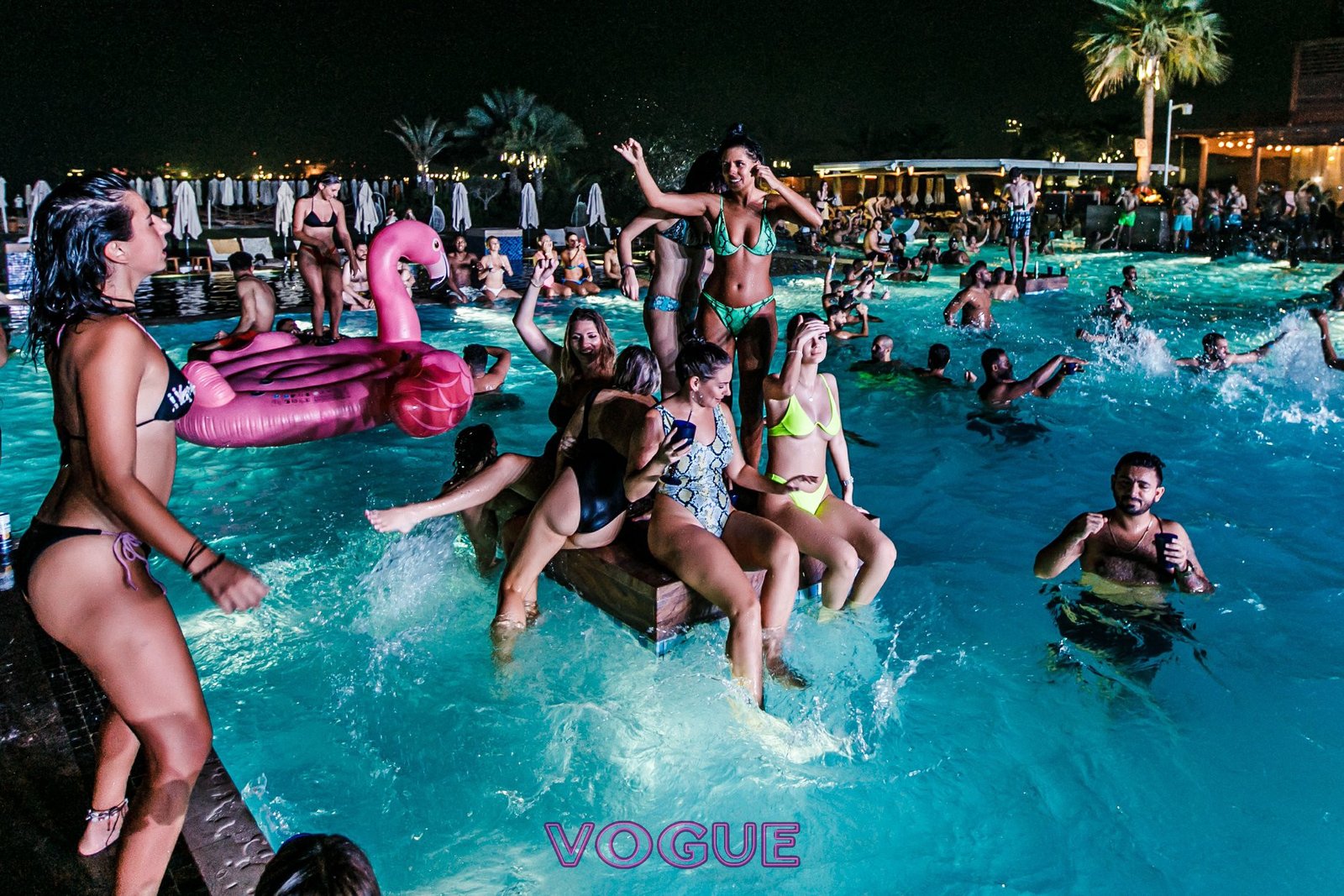 Dubai pool party with DJ, crowd, and luxury hotel poolside setting — Dubai Party Life